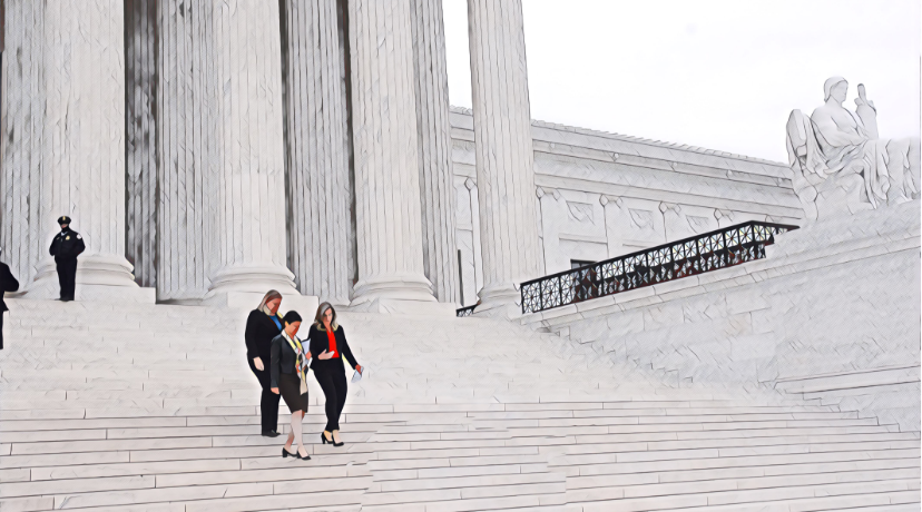 two people walking down the white marble steps of the Supreme Court building