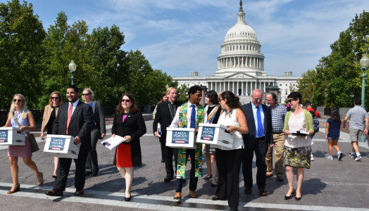 timeline-johnson-amendment Illustration of men and women walking in front of the Capitol and some are holding boxes